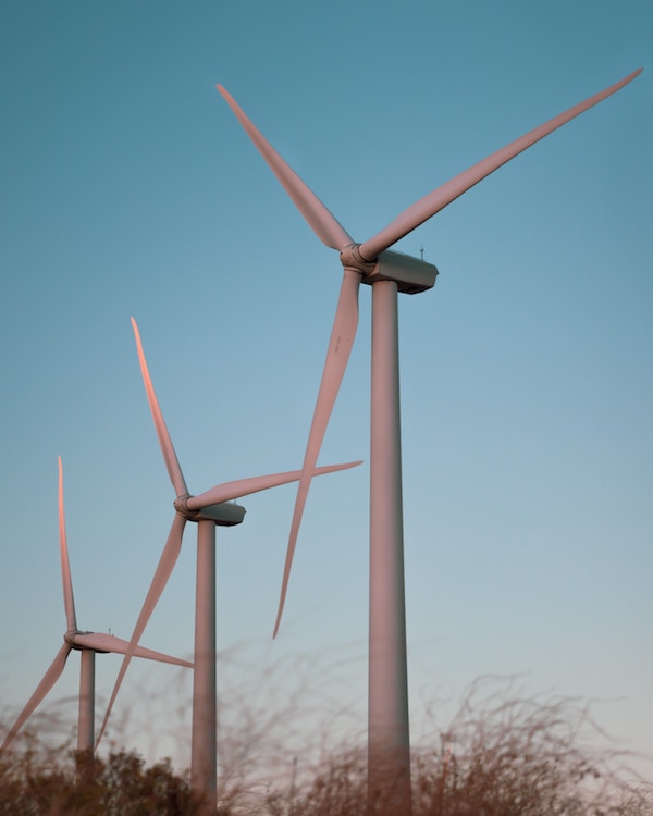 A group of wind turbines in a field in the U.K.