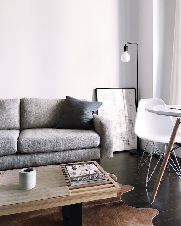 A living room with an eco-friendly gray couch and coffee table.