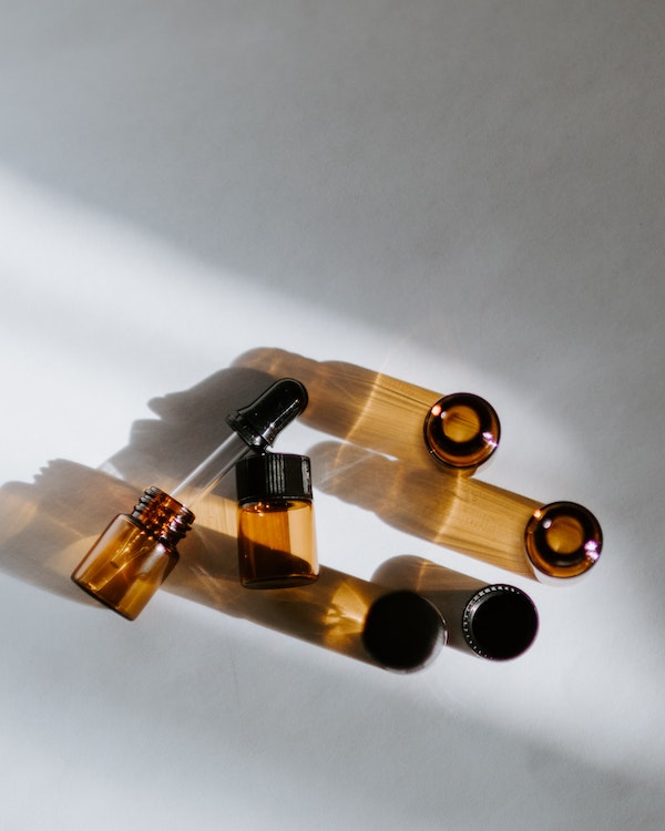 Lavender essential oil on a white surface.