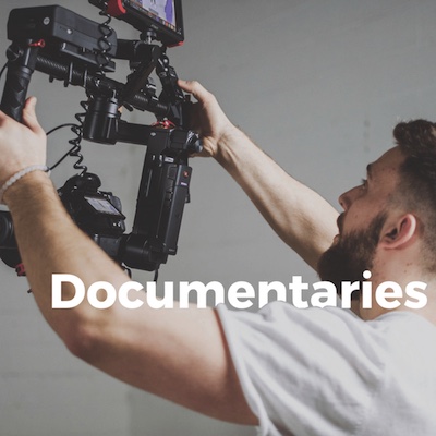 A man holding a camera with the words documentaries on the SEO-optimized homepage.