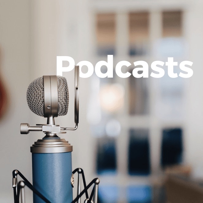 A microphone with the words podcasts in front of it, showcasing its importance in homepage design.