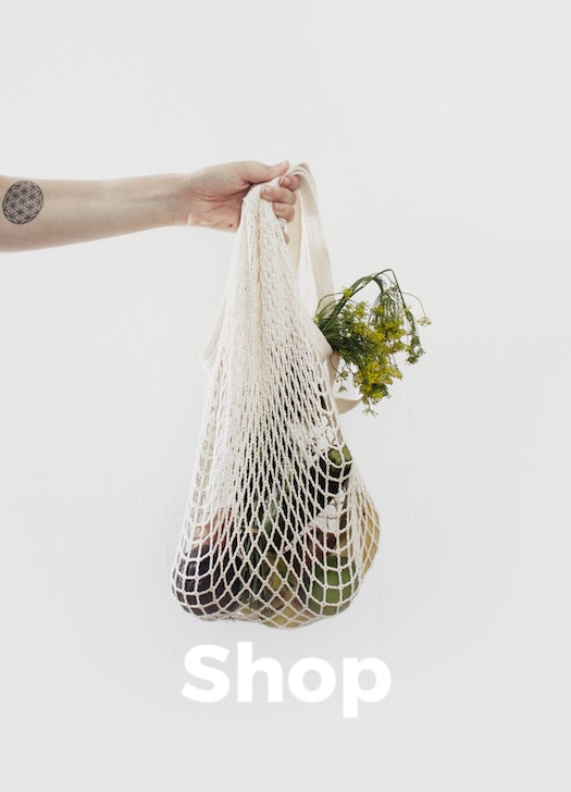 An image of a person holding a net shopping bag featured on the homepage.